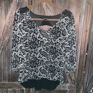 A. Byer adorable backless top. The back is mixed material, lower is sheer.